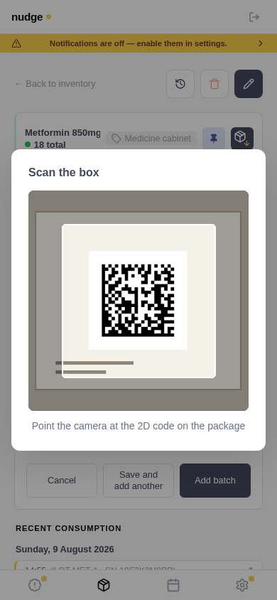Scanner open on a medicine box, the DataMatrix framed inside the viewfinder